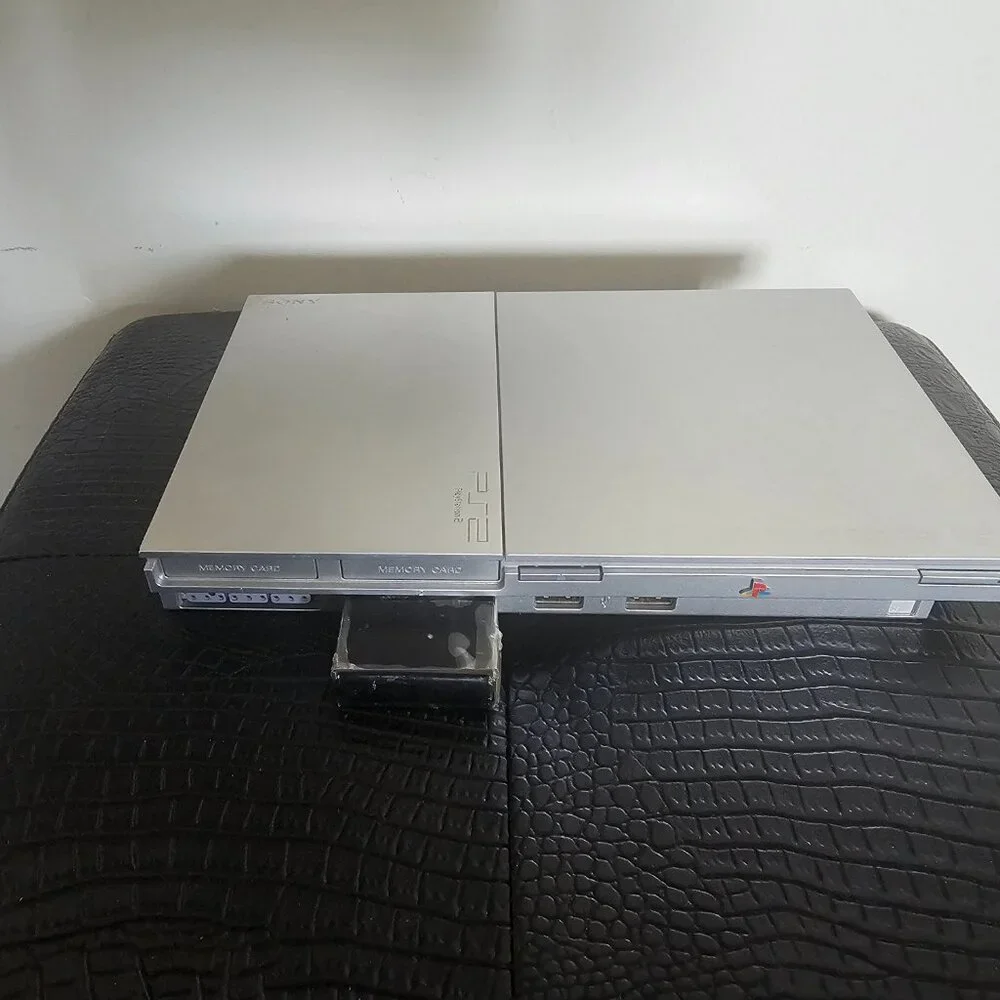 Playsation 2 (PS2 Fat) with controllers and games and PS2 Slim